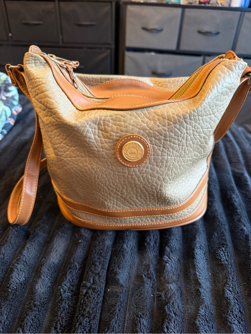 Monique Chantel beige leather handbag with tan trim and textured pebbled finish